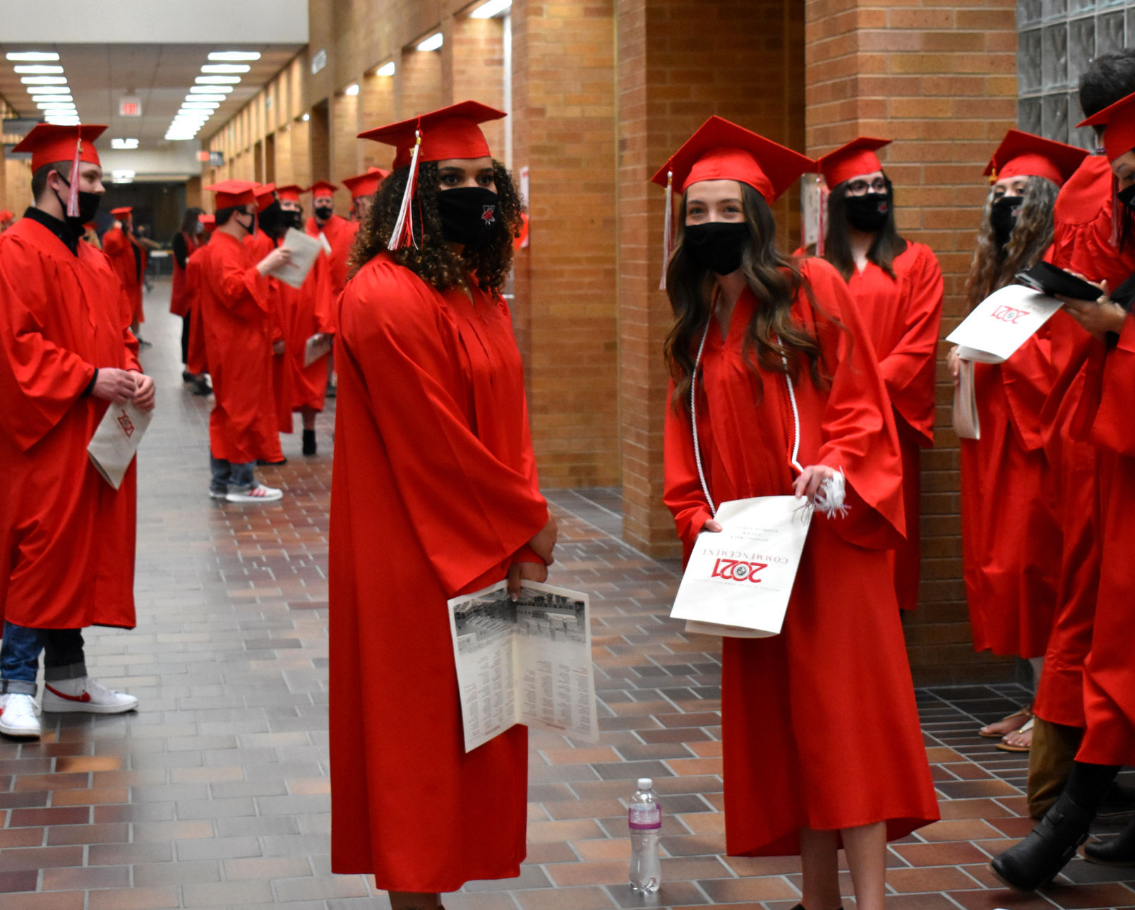 Western graduation 21 smiling hallway